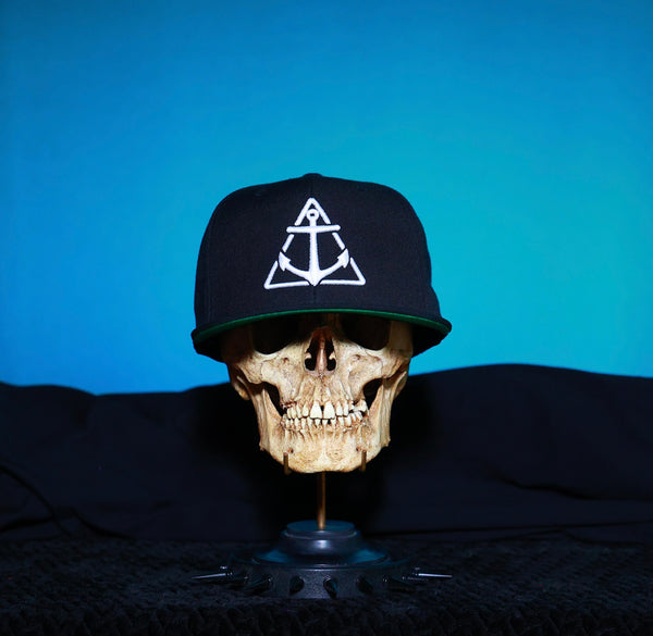 Black with White logo Flat Bill Hat-Green under cap.